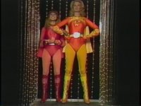 ElectraWoman and DynaGirl standing in an elevator