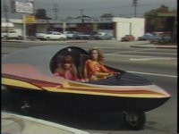 ElectraWoman and DynaGirl in their super car