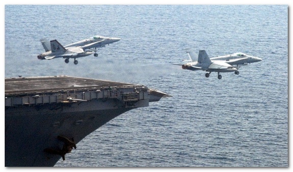 Fighter Jets taking off from an aircraft carrier, via Wikimedia Commons